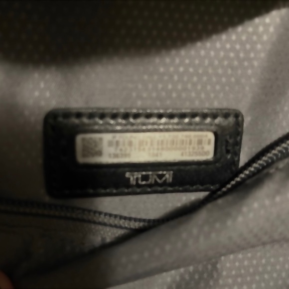 Tumi black leather style backpack- women